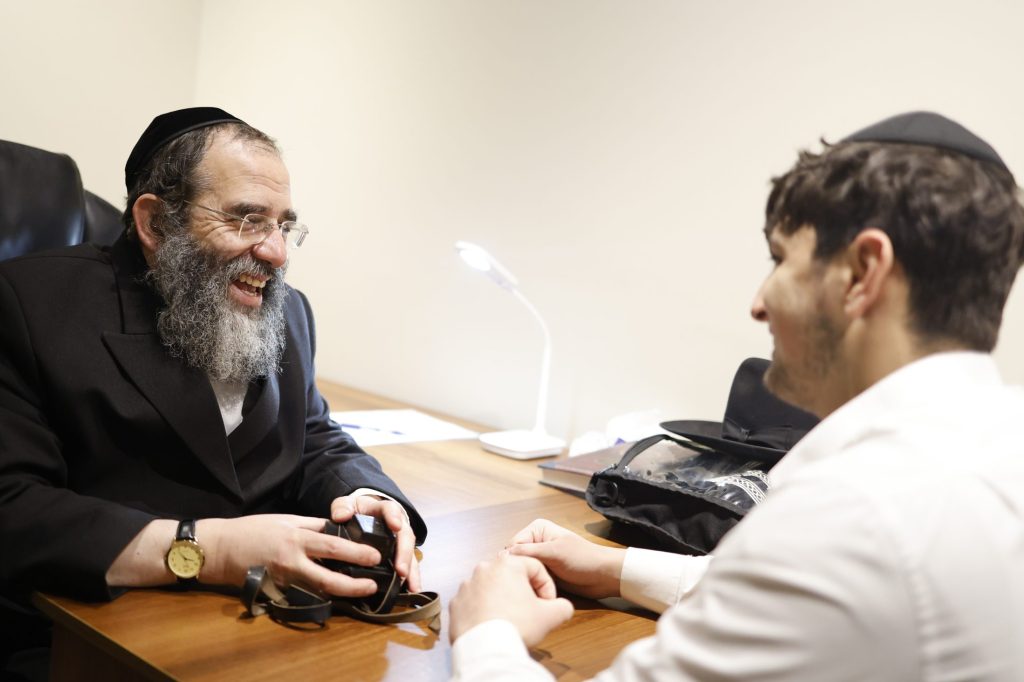 A Rebbe learning with a student